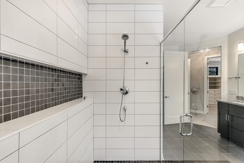 White Tile Shower with Glass Door